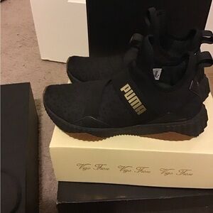 PUMA Black and Gold Sneakers